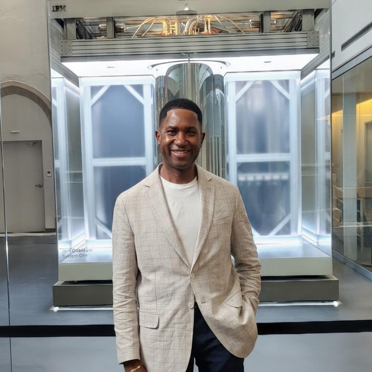 Executive portrait in front of IBM Quantum System One